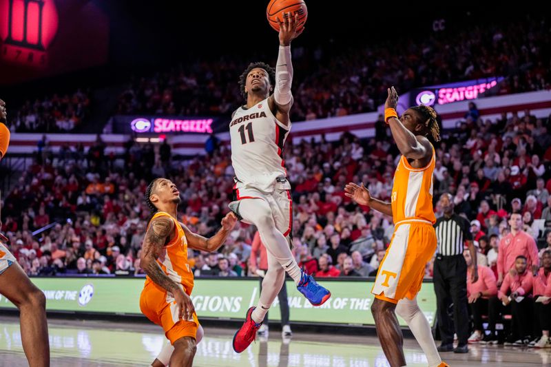 Jan 13, 2024; Athens, Georgia, USA; Georgia Bulldogs guard Justin Hill (11) takes the ball to the basket against the Tennessee Volunteers during the second half at Stegeman Coliseum. Mandatory Credit: Dale Zanine-USA TODAY Sports