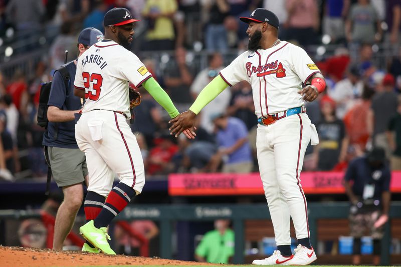 May 8, 2024; Atlanta, Georgia, USA; Atlanta Braves center fielder Michael Harris II (23) and designated hitter Marcell Ozuna (20) celebrate after a victory against the Boston Red Sox at Truist Park. Mandatory Credit: Brett Davis-USA TODAY Sports
