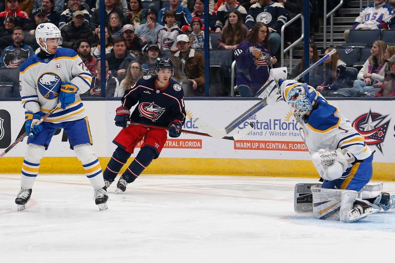 Feb 23, 2024; Columbus, Ohio, USA; Buffalo Sabres goalie Ukko-Pekka Luukkonen (1) makes a blocker save on the shot from Columbus Blue Jackets left wing Johnny Gaudreau (13) during the first period at Nationwide Arena. Mandatory Credit: Russell LaBounty-USA TODAY Sports