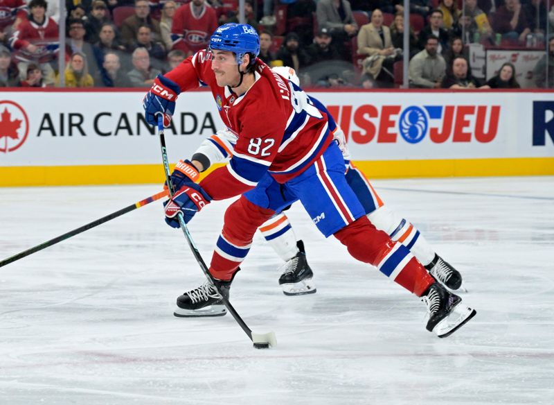 Nov 18, 2024; Montreal, Quebec, CAN; Montreal Canadiens forward Lucas Condotta (82) takes a shot on  net during the second period of the game against the Edmonton Oilers at the Bell Centre. Mandatory Credit: Eric Bolte-Imagn Images