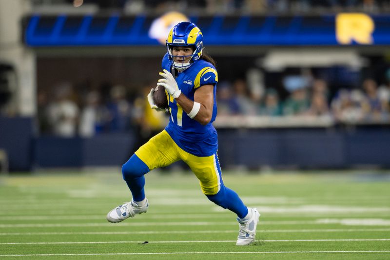 Los Angeles Rams wide receiver Puka Nacua (17) runs with the ball during an NFL football game against the Miami Dolphins, Monday, Nov. 11, 2024, in Inglewood, Calif. (AP Photo/Kyusung Gong)