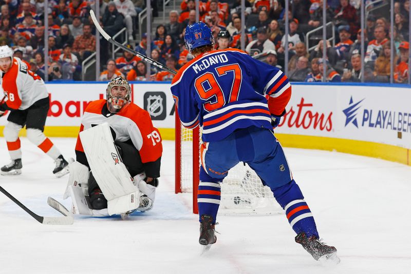 Jan 2, 2024; Edmonton, Alberta, CAN; Edmonton Oilers forward Connor McDavid (97) scores a goal during the first period on Philadelphia Flyers goaltender Carter Hart (79) at Rogers Place. Mandatory Credit: Perry Nelson-USA TODAY Sports