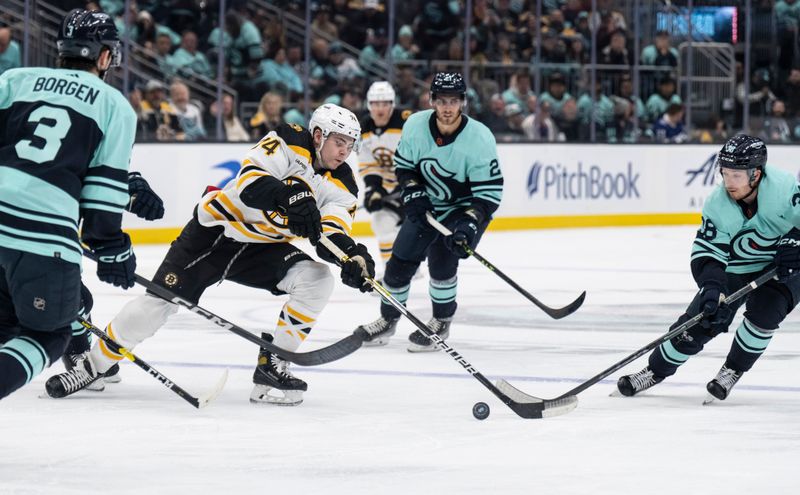 Feb 23, 2023; Seattle, Washington, USA; Boston Bruins forward Jake DeBrusk (74) skates against Seattle Kraken defenseman Will Borgen (3) and forward Jesper Froden (38) during the second period at Climate Pledge Arena. Mandatory Credit: Stephen Brashear-USA TODAY Sports