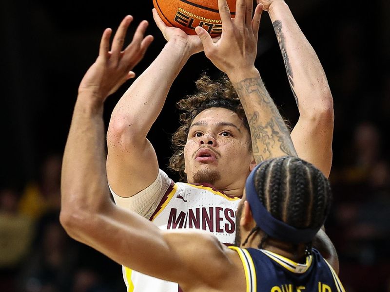 Jan 16, 2025; Minneapolis, Minnesota, USA; Minnesota Golden Gophers guard Lu'Cye Patterson (25) shoots as Michigan Wolverines guard Roddy Gayle Jr. (11) defends during the first half at Williams Arena. Mandatory Credit: Matt Krohn-Imagn Images