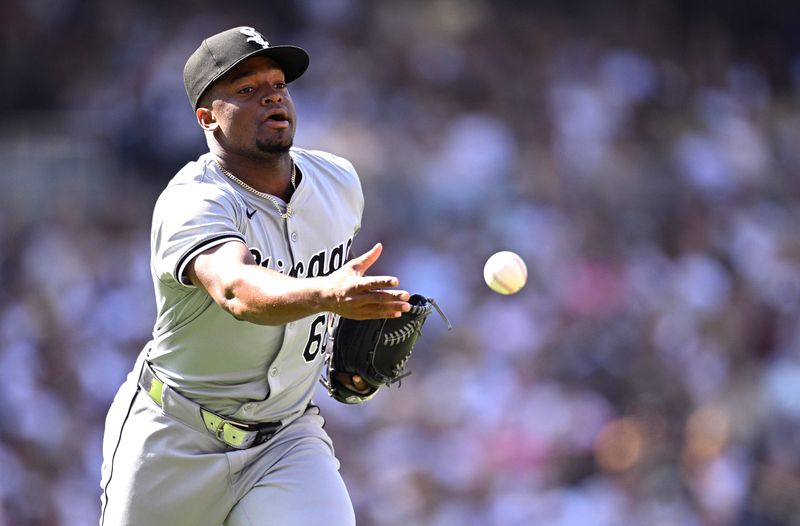 Sep 22, 2024; San Diego, California, USA; Chicago White Sox relief pitcher Prelander Berroa (66) tosses the ball to first base during the seventh inning against the San Diego Padres at Petco Park. Mandatory Credit: Orlando Ramirez-Imagn Images