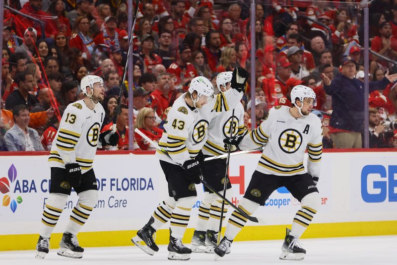 May 14, 2024; Sunrise, Florida, USA; Boston Bruins defenseman Charlie McAvoy (73) celebrates with teammates after scoring against the Florida Panthers during the second period in game five of the second round of the 2024 Stanley Cup Playoffs at Amerant Bank Arena. Mandatory Credit: Sam Navarro-USA TODAY Sports