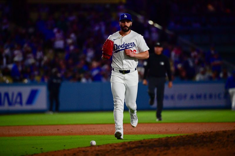 June 3, 2025; Los Angeles, California, USA; Los Angeles Dodgers pitcher Tanner Scott (66) comes in relief against the New York Mets for the tenth inning at Dodger Stadium. Mandatory Credit: Gary A. Vasquez-Imagn Images