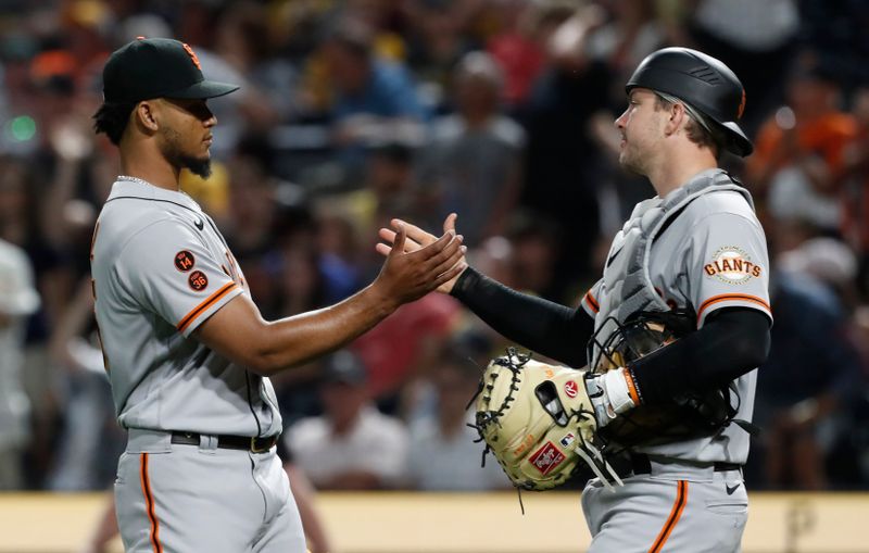 Jul 15, 2023; Pittsburgh, Pennsylvania, USA;  San Francisco Giants relief pitcher Camilo Doval (75) and catcher Patrick Bailey (14) shake hands after defeating the Pittsburgh Pirates at PNC Park. San Francisco won 3-1. Mandatory Credit: Charles LeClaire-USA TODAY Sports