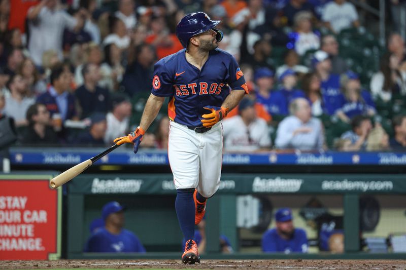 Apr 2, 2024; Houston, Texas, USA; Houston Astros second baseman Jose Altuve (27) hits a home run during the fourth inning against the Toronto Blue Jays at Minute Maid Park. Mandatory Credit: Troy Taormina-USA TODAY Sports