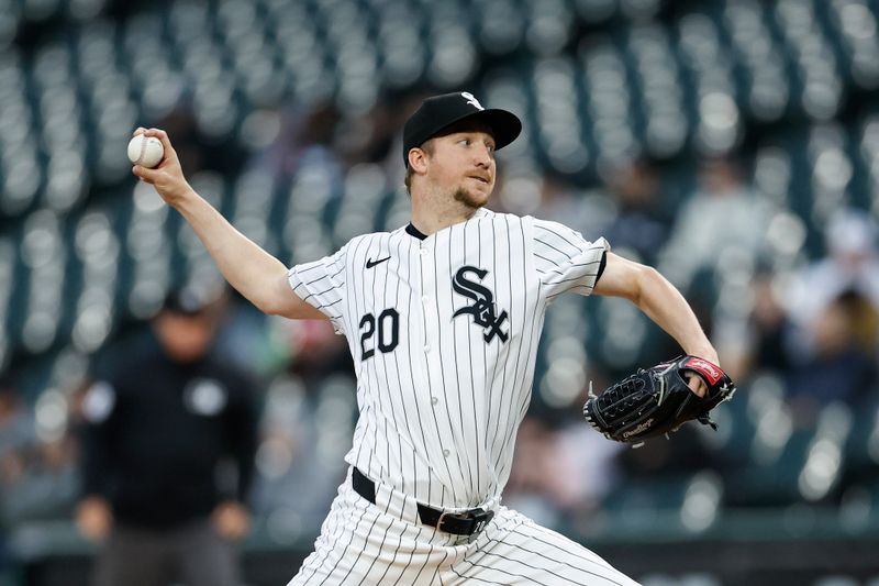 May 9, 2024; Chicago, Illinois, USA; Chicago White Sox starting pitcher Erick Fedde (20) delivers a pitch against the Cleveland Guardians during the first inning at Guaranteed Rate Field. Mandatory Credit: Kamil Krzaczynski-USA TODAY Sports