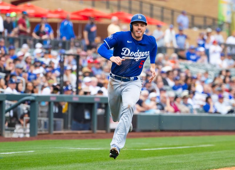 Feb 26, 2024; Salt River Pima-Maricopa, Arizona, USA; Los Angeles Dodgers first baseman Freddie Freeman scores a run against the Colorado Rockies during a spring training game at Salt River Fields at Talking Stick. Mandatory Credit: Mark J. Rebilas-USA TODAY Sports