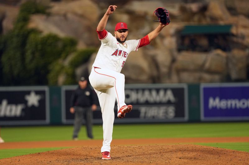 Jun 17, 2024; Anaheim, California, USA; Los Angeles Angels relief pitcher Carlos Estevez (53) celebrates at the end of the game against the Milwaukee Brewers at Angel Stadium. Mandatory Credit: Kirby Lee-USA TODAY Sports