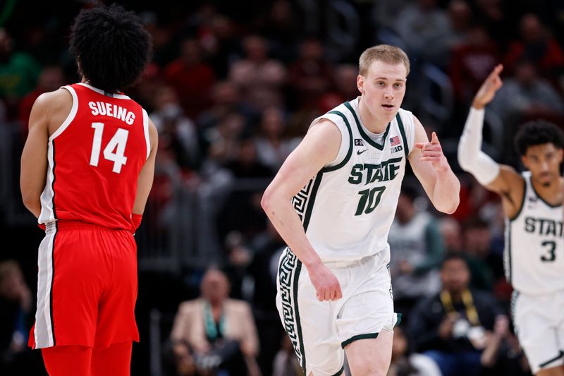 Mar 10, 2023; Chicago, IL, USA; Michigan State Spartans forward Joey Hauser (10) celebrates after scoring against the Ohio State Buckeyes during the first half at United Center. Mandatory Credit: Kamil Krzaczynski-USA TODAY Sports