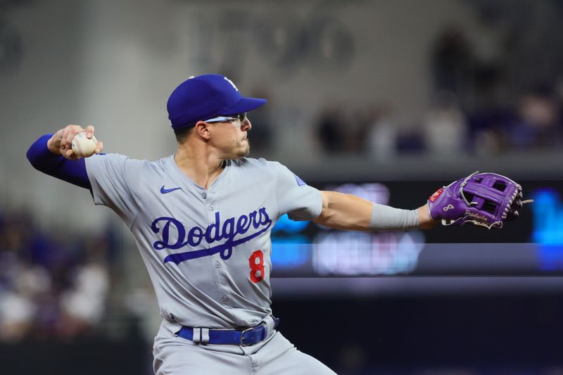 Sep 18, 2024; Miami, Florida, USA; Los Angeles Dodgers third baseman Enrique Hernandez (8) throws to first base to retire Miami Marlins third baseman Jake Burger (not pictured) during the sixth inning at loanDepot Park. Mandatory Credit: Sam Navarro-Imagn Images