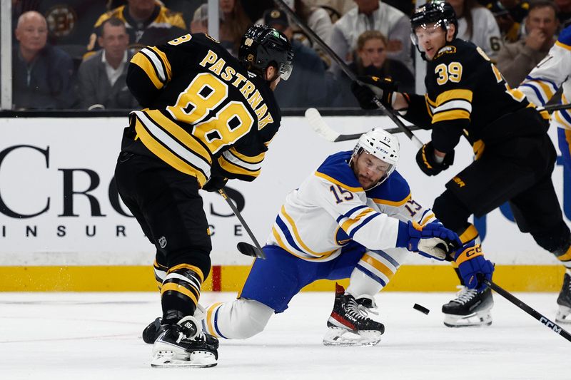 Oct 11, 2025; Boston, Massachusetts, USA; Buffalo Sabres right wing Justin Danforth (15) tries to block a shot by Boston Bruins right wing David Pastrnak (88) during the second period at TD Garden. Mandatory Credit: Winslow Townson-Imagn Images