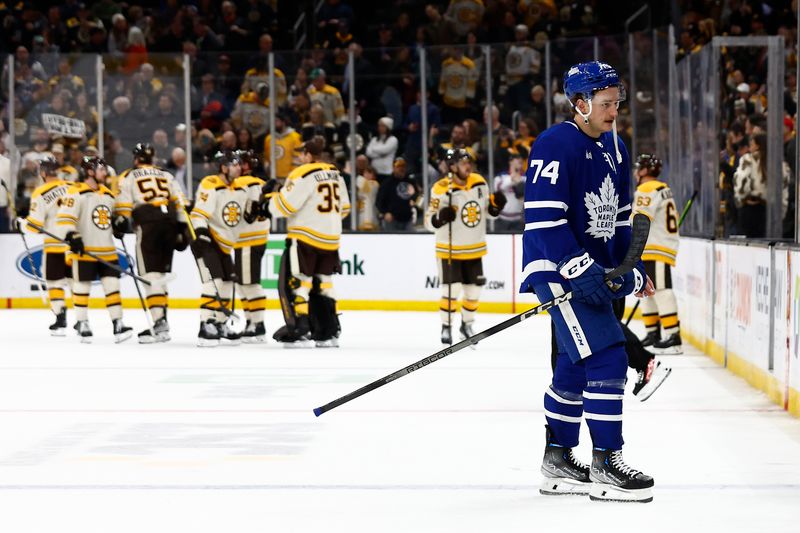 Mar 7, 2024; Boston, Massachusetts, USA; Toronto Maple Leafs center Bobby McMann (74) heads to the locker room as the Boston Bruins congratulate each other after their 4-1 win at TD Garden. Mandatory Credit: Winslow Townson-USA TODAY Sports