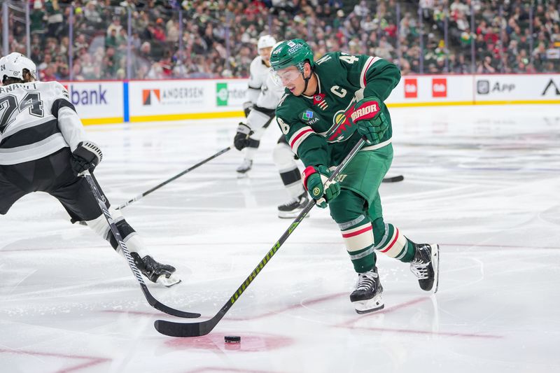 Nov 5, 2024; Saint Paul, Minnesota, USA; Minnesota Wild defenseman Jared Spurgeon (46) skates with the puck against the Los Angeles Kings in the second period at Xcel Energy Center. Mandatory Credit: Brad Rempel-Imagn Images