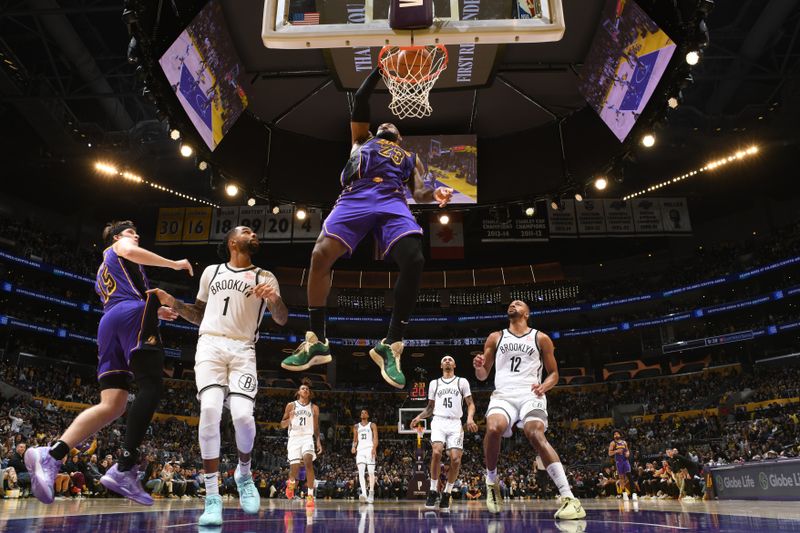 LOS ANGELES, CA - JANUARY 17: LeBron James #23 of the Los Angeles Lakers dunks the ball during the game against the Brooklyn Nets on January 17, 2025 at Crypto.Com Arena in Los Angeles, California. NOTE TO USER: User expressly acknowledges and agrees that, by downloading and/or using this Photograph, user is consenting to the terms and conditions of the Getty Images License Agreement. Mandatory Copyright Notice: Copyright 2025 NBAE (Photo by Adam Pantozzi/NBAE via Getty Images)