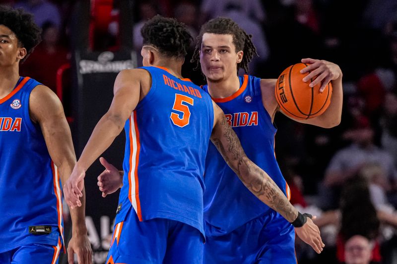 Feb 17, 2024; Athens, Georgia, USA; Florida Gators guards Will Richard (5) and Walter Clayton Jr. (1) react after defeating the Georgia Bulldogs at Stegeman Coliseum. Mandatory Credit: Dale Zanine-USA TODAY Sports