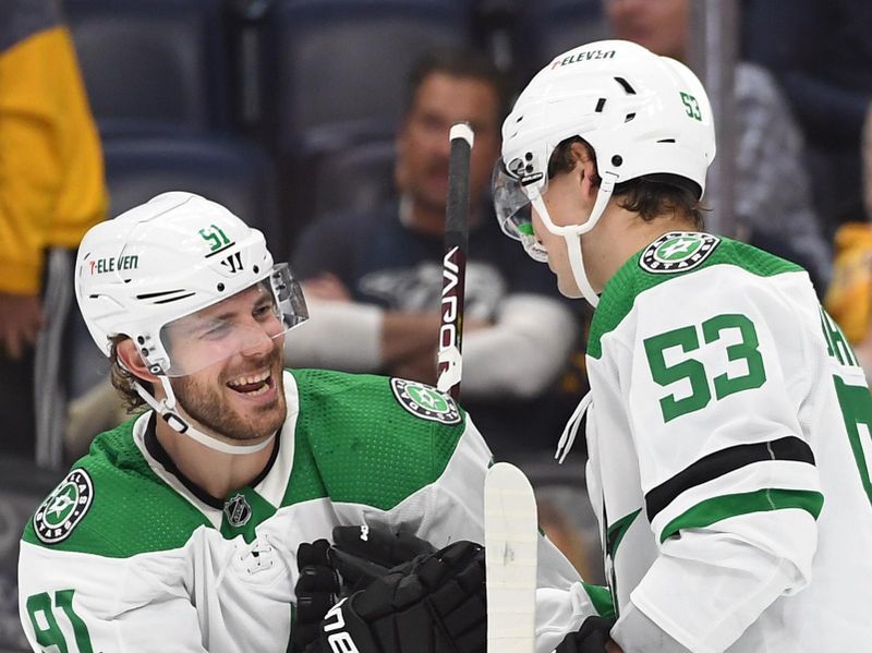 Oct 13, 2022; Nashville, Tennessee, USA; Dallas Stars center Wyatt Johnston (53) celebrates with center Tyler Seguin (91) after a goal during the third period against the Nashville Predators at Bridgestone Arena. Mandatory Credit: Christopher Hanewinckel-USA TODAY Sports