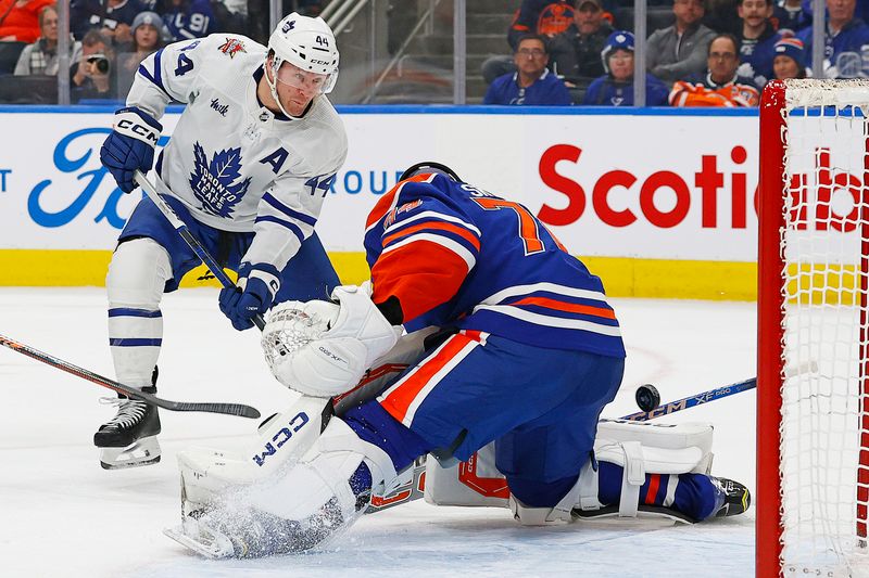 Jan 16, 2024; Edmonton, Alberta, CAN; Toronto Maple Leafs defensemen Morgan Rielly (44) scores a goal during the second period against Edmonton Oilers goaltender Stuart Skinner (74)  at Rogers Place. Mandatory Credit: Perry Nelson-USA TODAY Sports