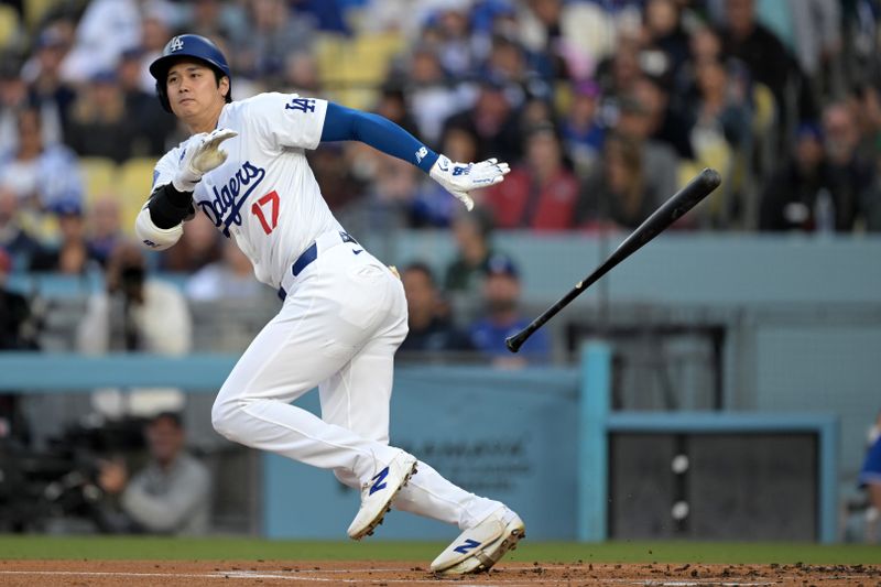 May 20, 2024; Los Angeles, California, USA;  Los Angeles Dodgers designated hitter Shohei Ohtani (17) singles on a bunt in the first inning against the Arizona Diamondbacks at Dodger Stadium. Mandatory Credit: Jayne Kamin-Oncea-USA TODAY Sports