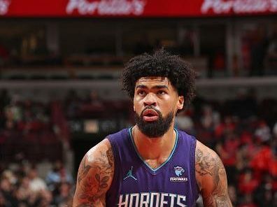 CHICAGO, IL - DECEMBER 6: Nick Richards #4 of the Charlotte Hornets shoots a free throw during the game against the Chicago Bulls on December 6, 2023 at the United Center in Chicago, Illinois. NOTE TO USER: User expressly acknowledges and agrees that, by downloading and or using this Photograph, user is consenting to the terms and conditions of the Getty Images License Agreement. Mandatory Copyright Notice: Copyright 2023 NBAE (Photo by Gary Dineen/NBAE via Getty Images).