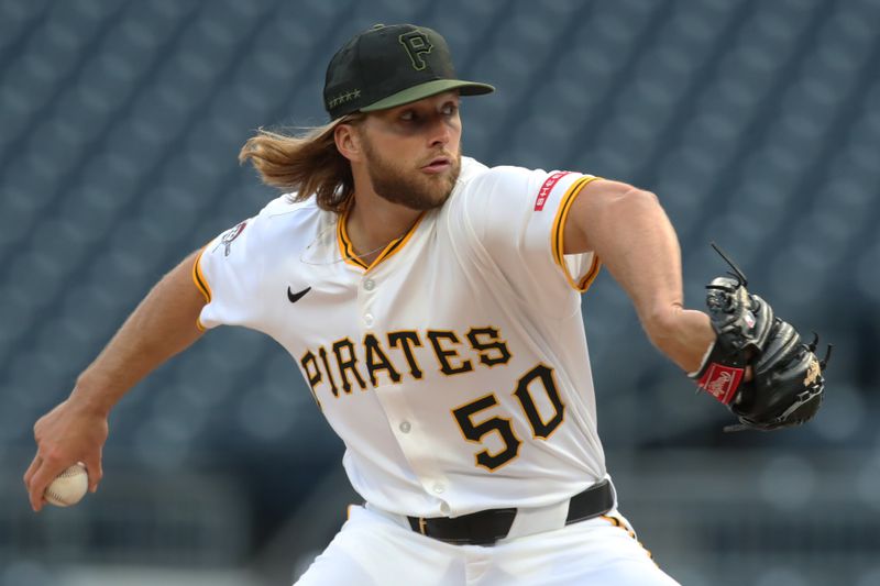 Apr 7, 2025; Pittsburgh, Pennsylvania, USA;  Pittsburgh Pirates pitcher Carmen Mlodzinski (50) delivers a pitch against the St. Louis Cardinals during the first inning at PNC Park. Mandatory Credit: Charles LeClaire-Imagn Images