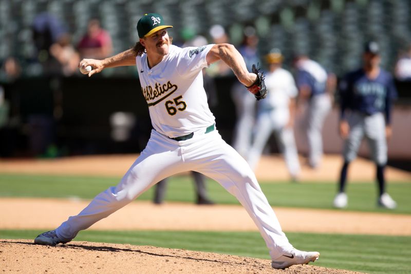 Sep 5, 2024; Oakland, California, USA; Oakland Athletics pitcher Tyler Ferguson (65) delivers a pitch against the Seattle Mariners during the ninth inning at Oakland-Alameda County Coliseum. Mandatory Credit: D. Ross Cameron-Imagn Images