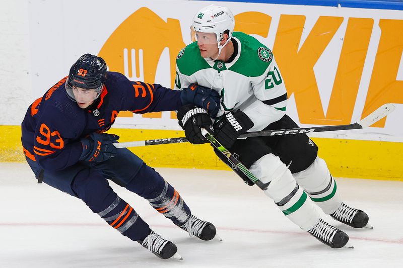 Nov 2, 2023; Edmonton, Alberta, CAN; Edmonton Oilers forward Ryan Nugent-Hopkins (93) and Dallas Stars defensemen Ryan Suter (20) look for a loose puck during the second period at Rogers Place. Mandatory Credit: Perry Nelson-USA TODAY Sports