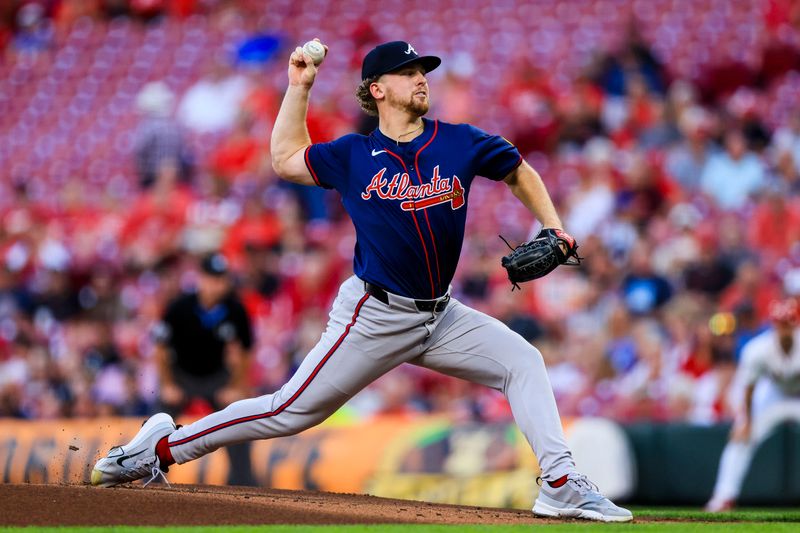 Sep 18, 2024; Cincinnati, Ohio, USA; Atlanta Braves starting pitcher Spencer Schwellenbach (56) pitches against the Cincinnati Reds in the first inning at Great American Ball Park. Mandatory Credit: Katie Stratman-Imagn Images