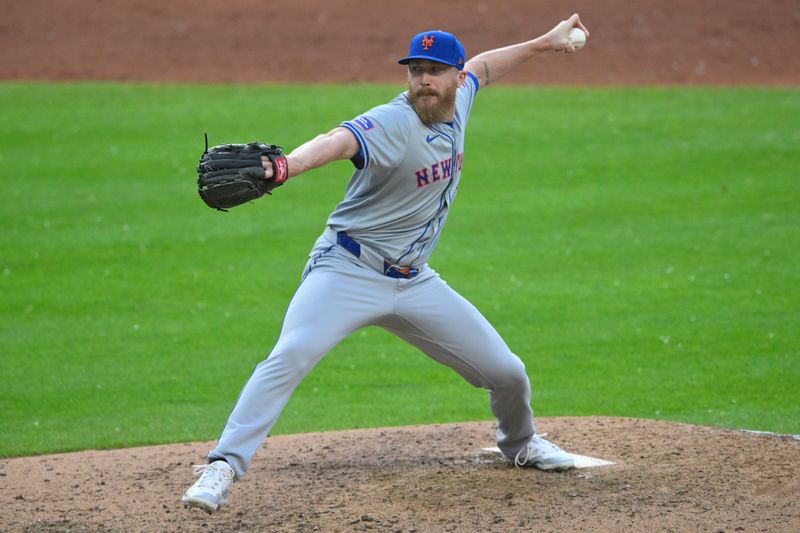 May 21, 2024; Cleveland, Ohio, USA; New York Mets relief pitcher Jake Diekman (30) delivers a pitch in the the sixth inning against the Cleveland Guardians at Progressive Field. Mandatory Credit: David Richard-USA TODAY Sports