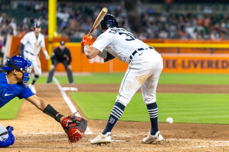 Aug 22, 2023; Detroit, Michigan, USA; Detroit Tigers right fielder Kerry Carpenter (30) is hit by a pitch in the eighth inning with bases loaded against the Chicago Cubs at Comerica Park. Mandatory Credit: David Reginek-USA TODAY Sports