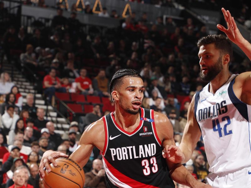 PORTLAND, OR - DECEMBER 1: Toumani Camara #33 of the Portland Trail Blazers handles the ball during the game against the Dallas Mavericks on December 1, 2024 at the Moda Center Arena in Portland, Oregon. NOTE TO USER: User expressly acknowledges and agrees that, by downloading and or using this photograph, user is consenting to the terms and conditions of the Getty Images License Agreement. Mandatory Copyright Notice: Copyright 2024 NBAE (Photo by Cameron Browne/NBAE via Getty Images)