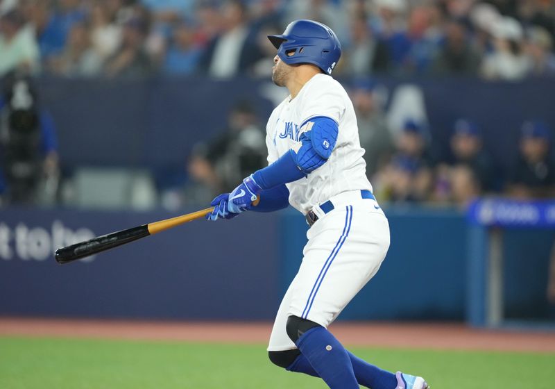 Jun 28, 2023; Toronto, Ontario, CAN; Toronto Blue Jays right fielder George Springer (4) hits a double against the San Francisco Giants during the first inning at Rogers Centre. Mandatory Credit: Nick Turchiaro-USA TODAY Sports