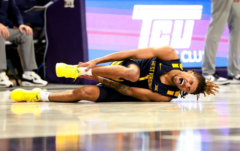 Feb 12, 2024; Fort Worth, Texas, USA; West Virginia Mountaineers guard Noah Farrakhan (1) reacts after an injury during the second half against the TCU Horned Frogs at Ed and Rae Schollmaier Arena. Mandatory Credit: Kevin Jairaj-USA TODAY Sports