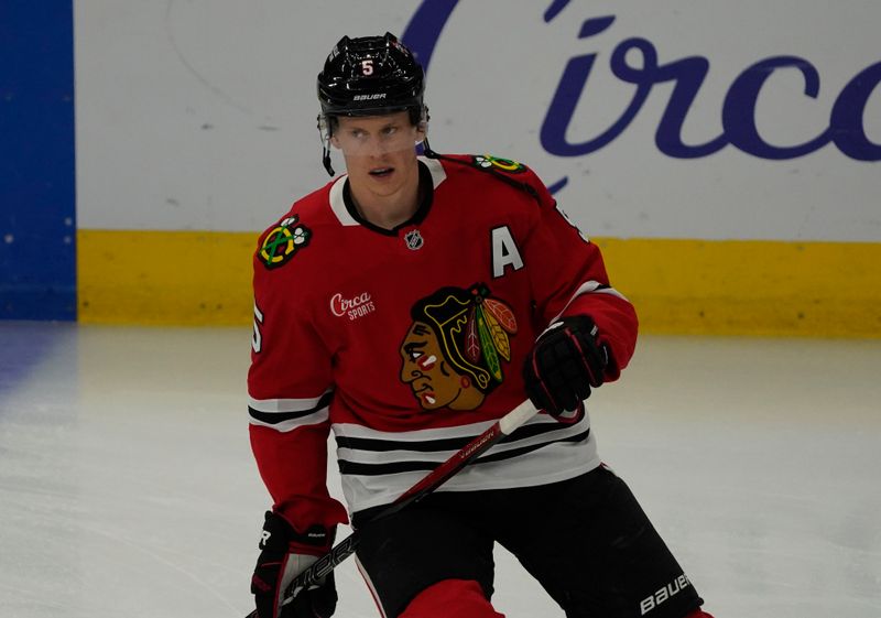 Oct 25, 2024; Chicago, Illinois, USA; Chicago Blackhawks defenseman Connor Murphy (5) warms up before a game against the Nashville Predators at United Center. Mandatory Credit: David Banks-Imagn Images