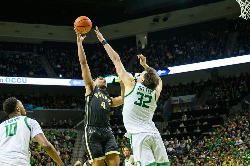 Jan 18, 2025; Eugene, Oregon, USA; Purdue Boilermakers forward Trey Kaufman-Renn (4) shoots the ball over Oregon Ducks center Nate Bittle (32) during the second half at Matthew Knight Arena. Mandatory Credit: Craig Strobeck-Imagn Images