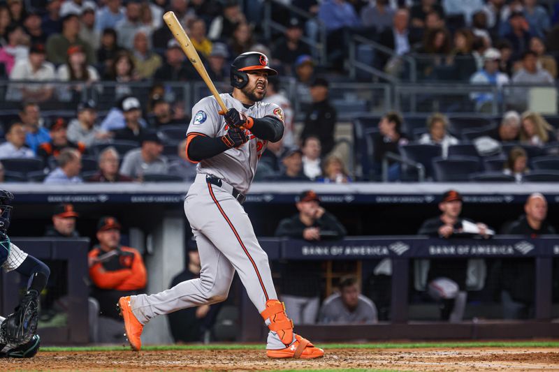 Sep 24, 2024; Bronx, New York, USA; Baltimore Orioles right fielder Anthony Santander (25) hits a solo home run during the sixth inning against the New York Yankees at Yankee Stadium. Mandatory Credit: Vincent Carchietta-Imagn Images