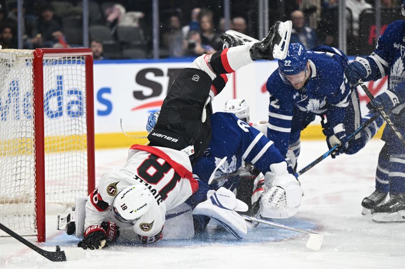 Feb 28, 2026; Toronto, Ontario, CAN;  Ottawa Senators forward Tim Stutzle (18) falls over Toronto Maple Leafs goalie Joseph Woll (60) as he pursues the puck in the second period at Scotiabank Arena. Mandatory Credit: Dan Hamilton-Imagn Images