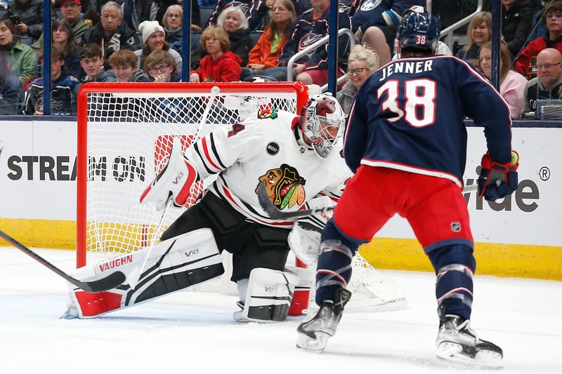 Nov 22, 2023; Columbus, Ohio, USA; Columbus Blue Jackets center Boone Jenner (38) scores a goal against Chicago Blackhawks goalie Petr Mrazek (34) during the first period at Nationwide Arena. Mandatory Credit: Russell LaBounty-USA TODAY Sports