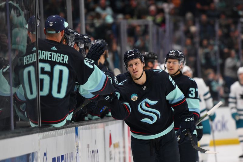 Nov 22, 2023; Seattle, Washington, USA; Seattle Kraken right wing Eeli Tolvanen (20) celebrates with the bench after scoring a goal against the San Jose Sharks during the third period at Climate Pledge Arena. Mandatory Credit: Steven Bisig-USA TODAY Sports