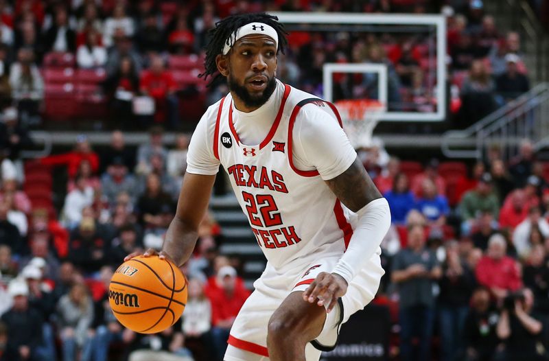 Jan 20, 2024; Lubbock, Texas, USA;  Texas Tech Red Raiders forward Warren Washington (22) dribbles the ball against the Brigham Young Cougars in the first half at United Supermarkets Arena. Mandatory Credit: Michael C. Johnson-USA TODAY Sports