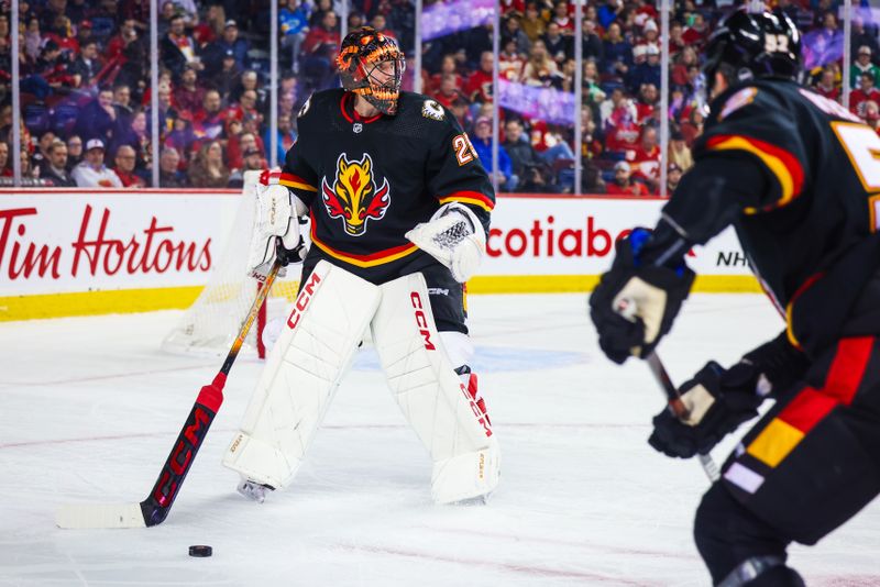 Jan 23, 2024; Calgary, Alberta, CAN; Calgary Flames goaltender Jacob Markstrom (25) controls the puck against the St. Louis Blues during the first period at Scotiabank Saddledome. Mandatory Credit: Sergei Belski-USA TODAY Sports