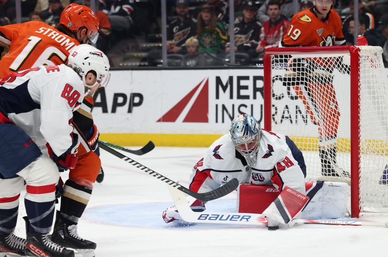 Mar 11, 2025; Anaheim, California, USA; Washington Capitals goaltender Logan Thompson (48) makes a save Anaheim Ducks center Ryan Strome (16) during the second period at Honda Center. Mandatory Credit: Jason Parkhurst-Imagn Images