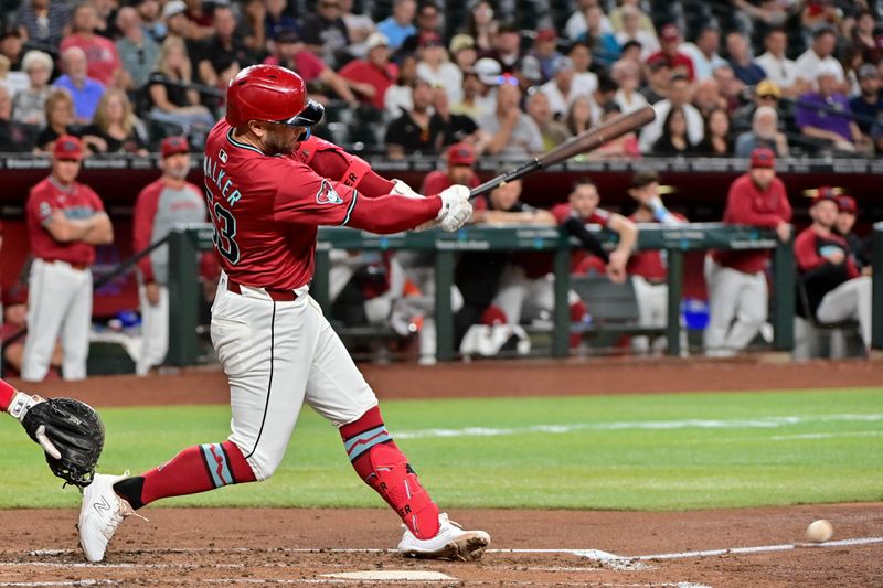 May 15, 2024; Phoenix, Arizona, USA;  Arizona Diamondbacks first baseman Christian Walker (53) singles in the fourth inning against the Cincinnati Reds at Chase Field. Mandatory Credit: Matt Kartozian-USA TODAY Sports