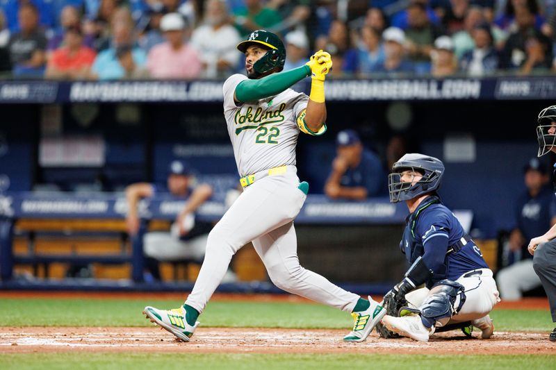 May 28, 2024; St. Petersburg, Florida, USA;  Oakland Athletics outfielder Miguel Andujar (22) hits a three run home run against the Tampa Bay Rays in the sixth inning  at Tropicana Field. Mandatory Credit: Nathan Ray Seebeck-USA TODAY Sports