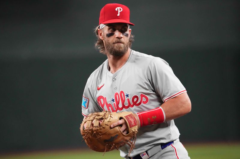 Aug 8, 2024; Phoenix, Arizona, USA; Philadelphia Phillies first base Bryce Harper (3) looks on against the Arizona Diamondbacks during the first inning at Chase Field. Mandatory Credit: Joe Camporeale-USA TODAY Sports