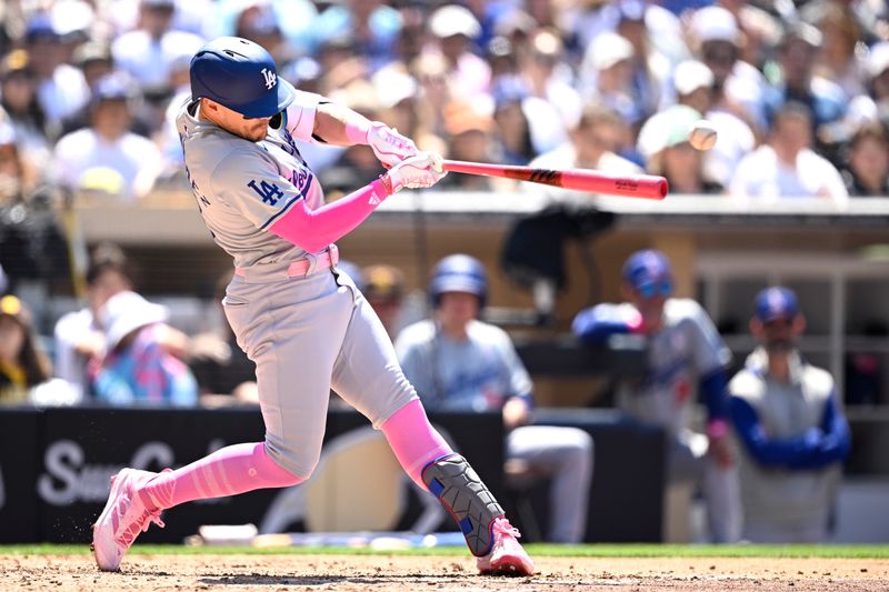 May 12, 2024; San Diego, California, USA; Los Angeles Dodgers left fielder Enrique Hernandez (8) hits a single against the San Diego Padres during the fifth inning at Petco Park. Mandatory Credit: Orlando Ramirez-USA TODAY Sports