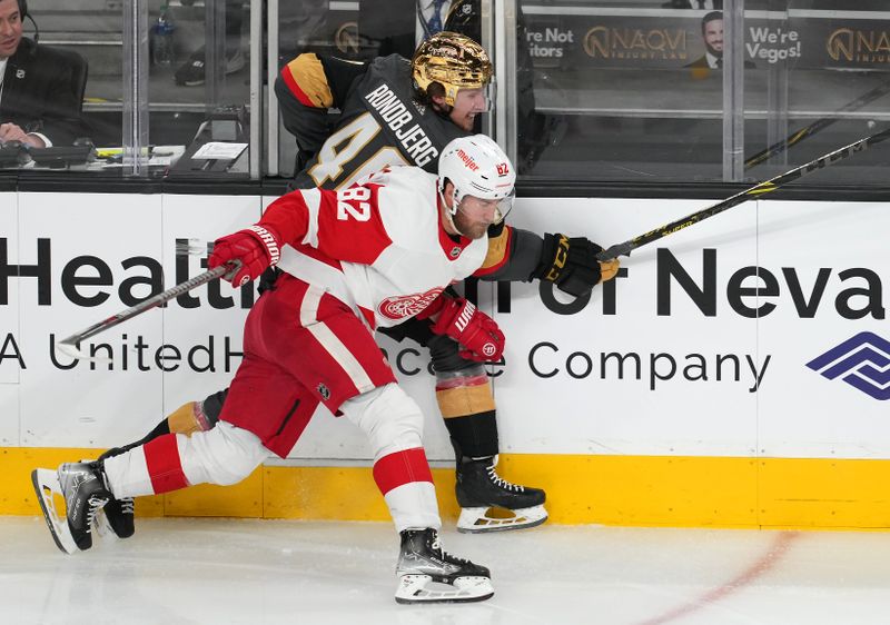 Jan 19, 2023; Las Vegas, Nevada, USA; Detroit Red Wings defenseman Jordan Oesterle (82) checks Vegas Golden Knights right wing Jonas Rondbjerg (46) during the third period at T-Mobile Arena. Mandatory Credit: Stephen R. Sylvanie-USA TODAY Sports